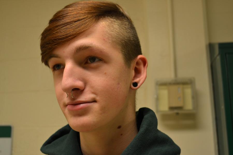 Glen Hooper (11) shows off his septum peircing and his stretchlobes.