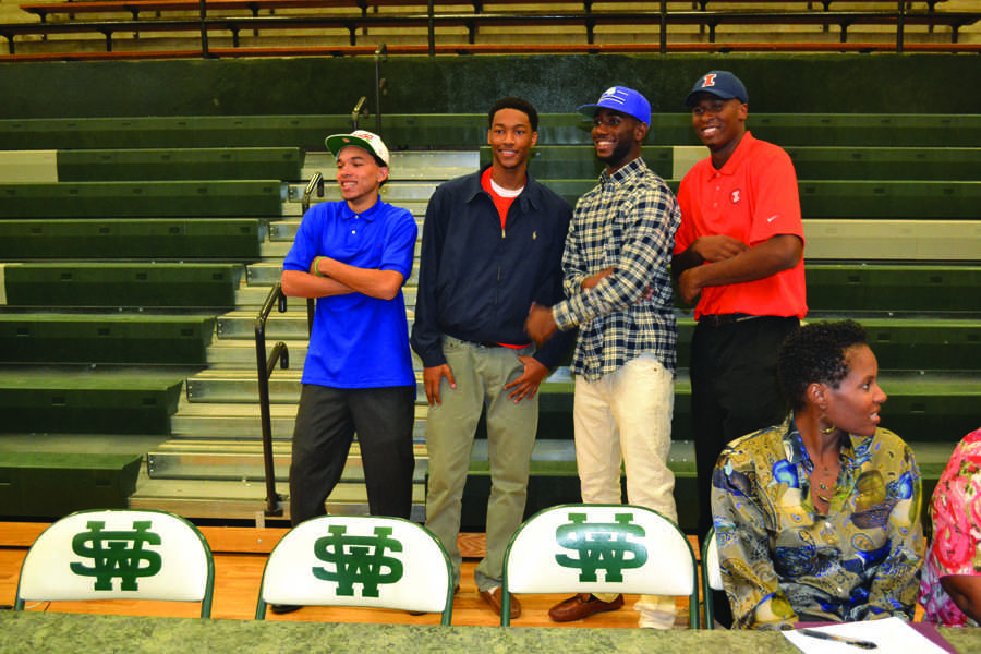 Seniors Chris Chiozza (Florida), Curtis Phillips (Campbell), Davell Roby (Saint Louis), and Leron Black (Illinois) celebrate signing their National Letters