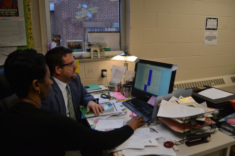 Instructional Facilitators Terry NeSmith and Tammie Hayes looking over observation results