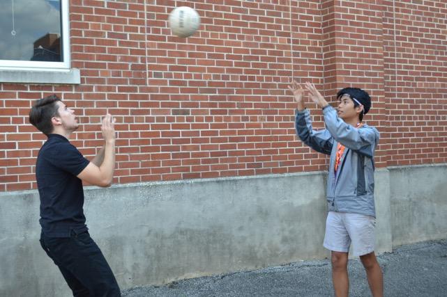 Club presidents Tien Le and Miguel Vivar-Alcalde (12) setting the ball to one another. 