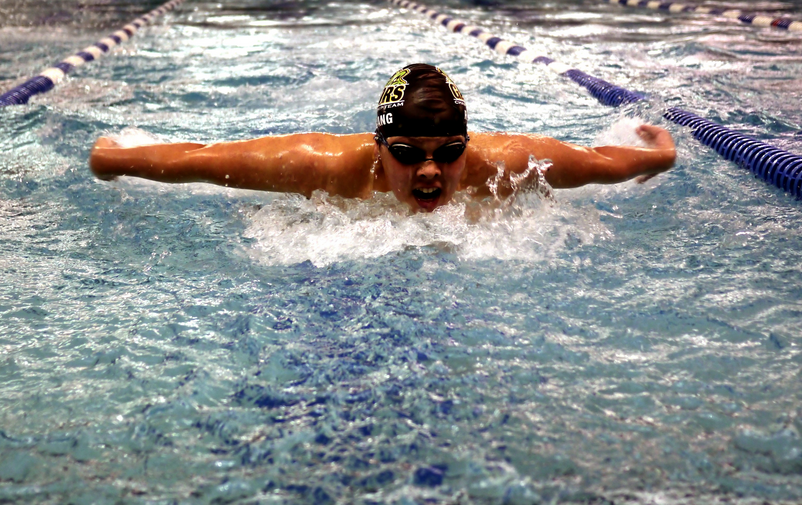 Swimmer Roland Chang (10) showing off his talent at a swim meet.
