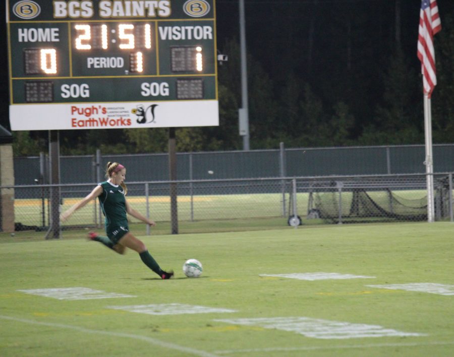 Alex Harber (12) setting up a lob pass to her teammates during a game against Briarcrest 
