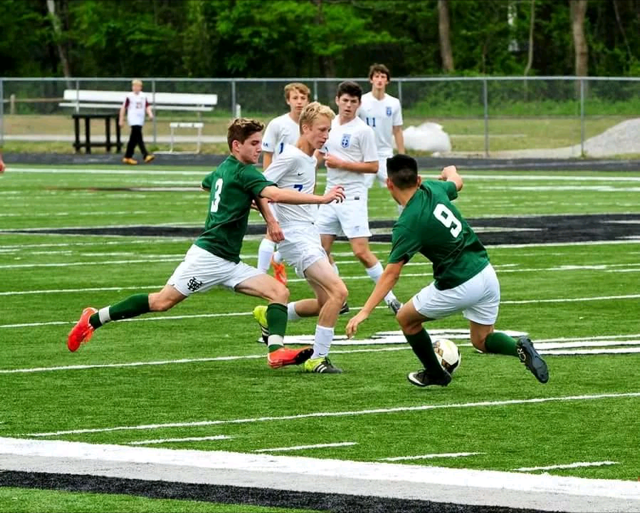 Two White Station players compete for a loose ball in a game last season