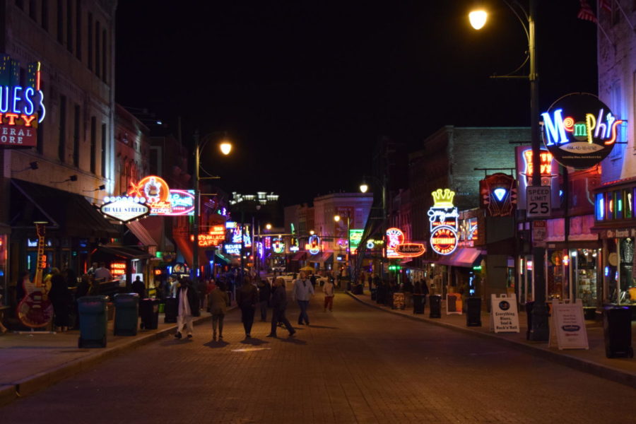 Memphians+and+visitors+enjoy+a+night+out+amidst+the+lights+and+music+of+Beale+Street.%0A