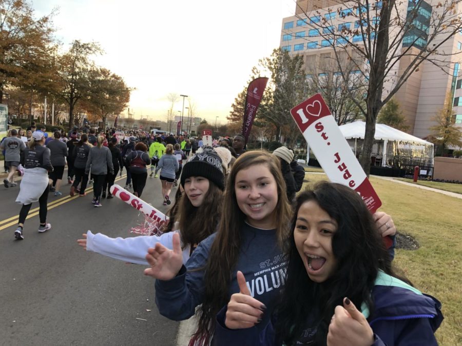 Student volunteers cheer on St. Jude runners and walkers in the annual marathon.
