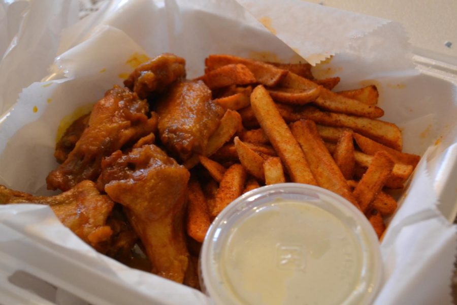 Bosses%E2%80%99+honey-hot+wing+combination+takeout+order+with+a+side+of+ranch+dipping+sauce.