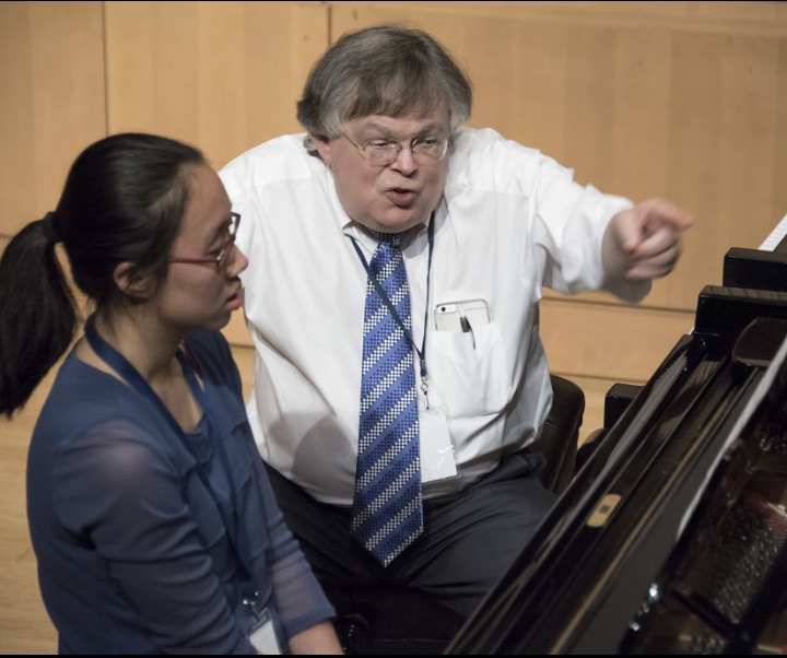 At a competition in West Virginia, Jie Wang(11) is critiqued by a judge after she finishes her composition.