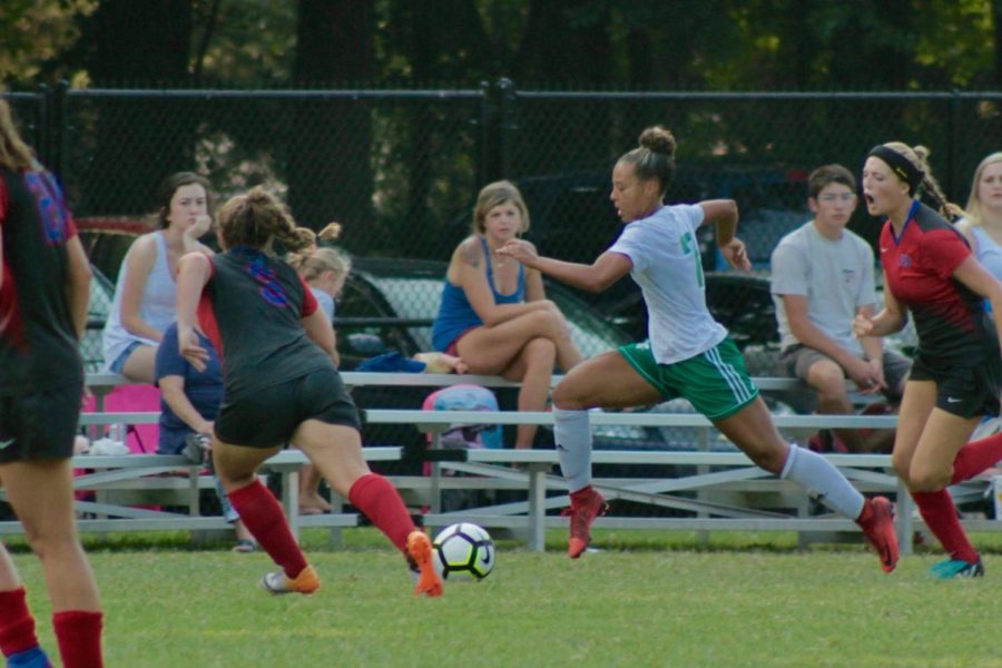 Senior Kourtnie Kelley dribbles the ball down the field in White Station’s game against Bartlett. The Lady Spartans were ultimately defeated 0-1 after a tough game.