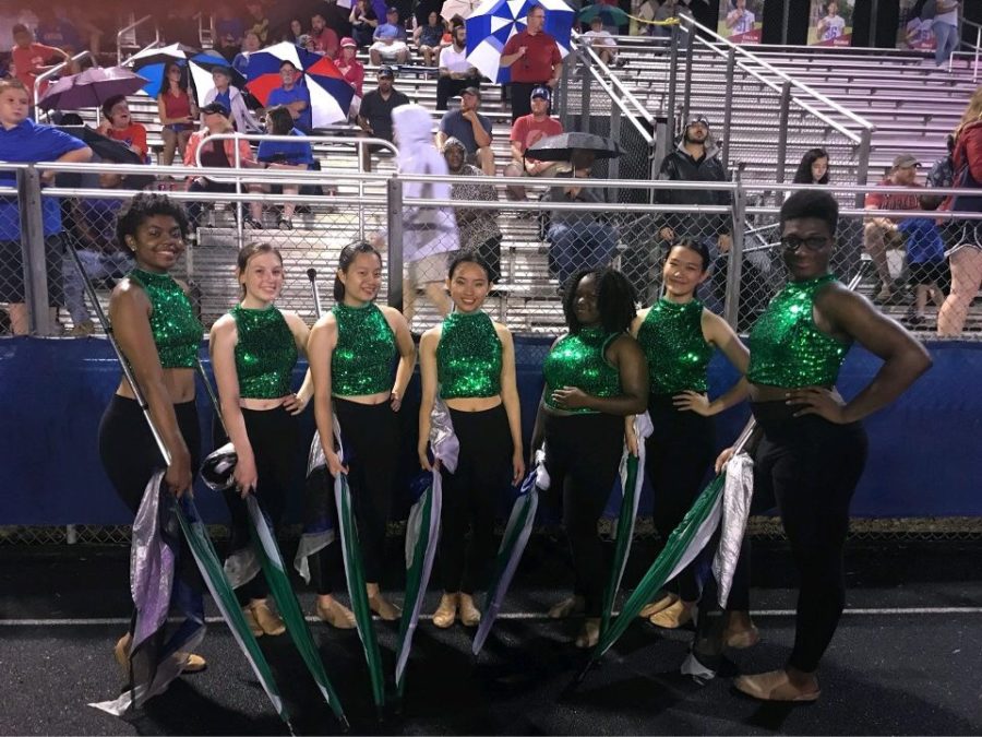 The color guard team, composed of 7 members, performs at Friday night football games alongside the marching band. The captains of the team are sisters, Brandy and Molly Yuan.
