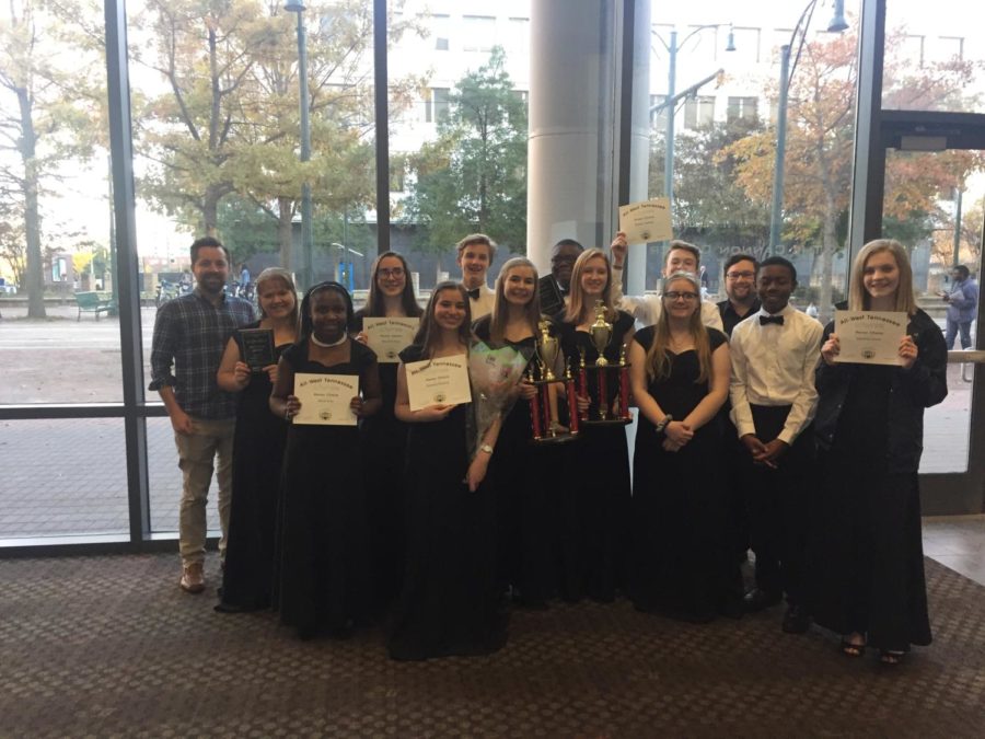 The Spartan singers, some with four, five, or six year awards pose for a picture after the concert.