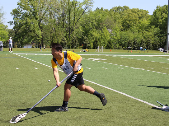 Padethkane Rasasack (12) practices for his upcoming lacrosse season at Lausanne Collegiate School. This is his second year on the team, granting him the opportunity to be captain. 