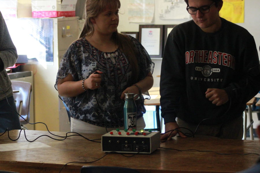 Tara Sandlin (12) and Gino Giorgianni (10) practice with buzzers to simulate a tournament and practice their Knowledge Bowl skills.