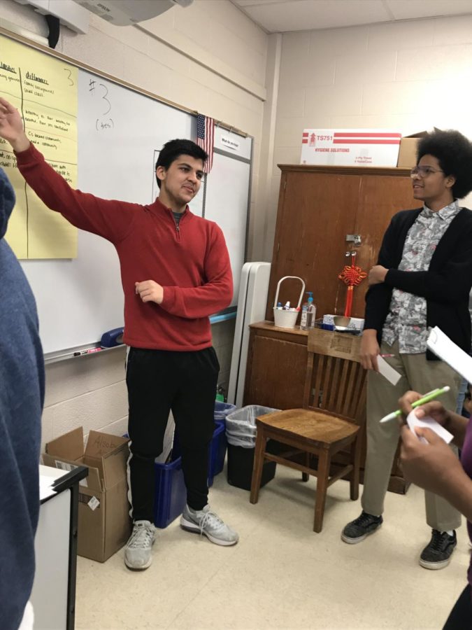 Junior Muaz Khan describes his groups chart comparing topics in chapter four of Outliers  to visiting groups. Mrs. Alsobrooks AP Lang classes have been studying the book for the past few weeks and determining their own definitions of success. 