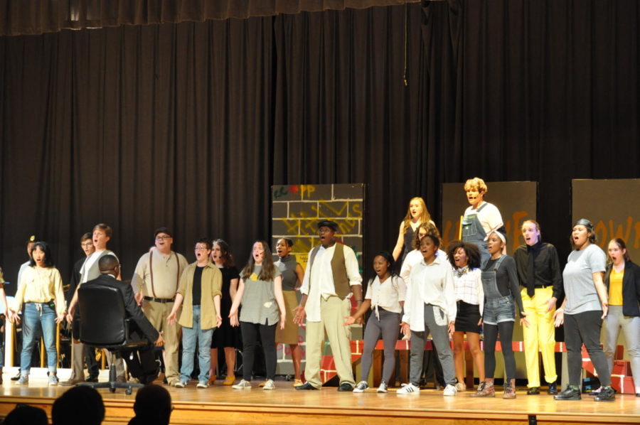 Urinetown members pose during their first dance number.