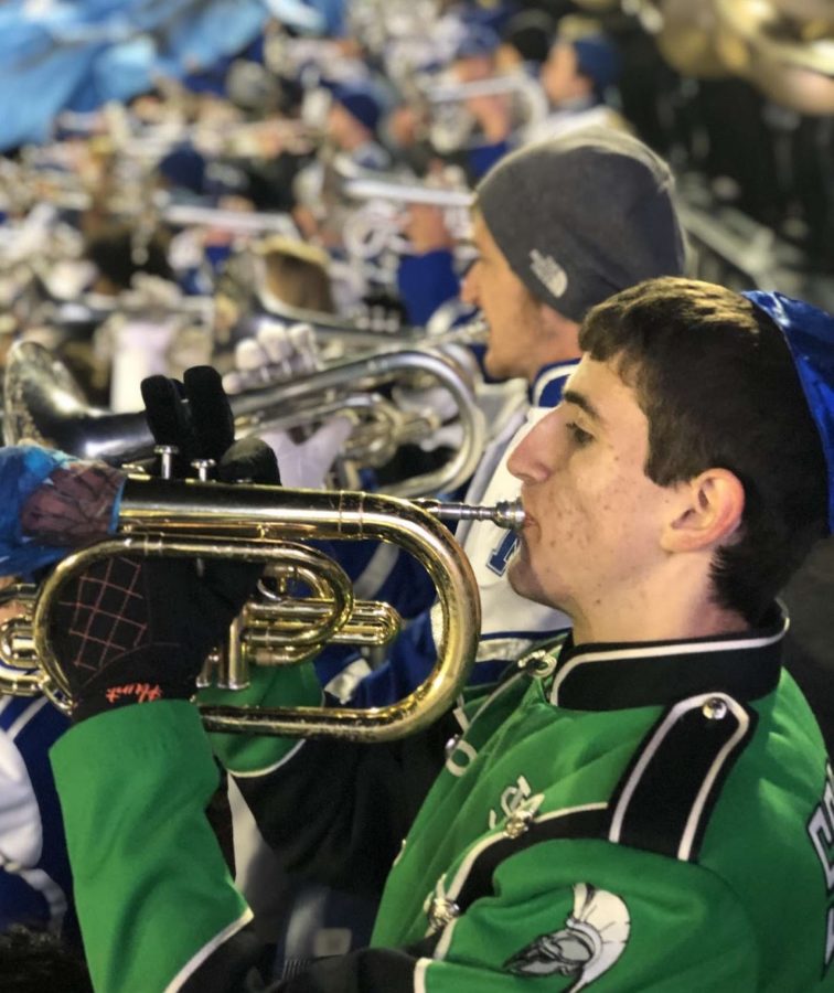 Cody Hunter performs alongside fellow mellophone players from the University of Memphis marching band. Cody attended his third Band Day this year and learned new skills from U of M students, despite being a senior. 