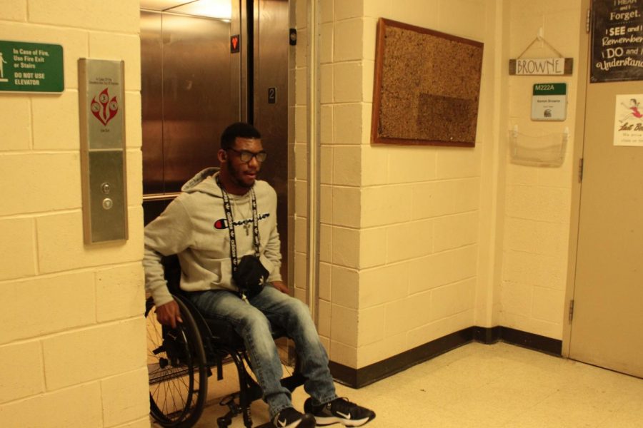 Kobe Cunningham (12) exits a main building elevator in his wheelchair. There are elevators, lifts and ramps located all around White Station that make the school handicap-accessible. 
