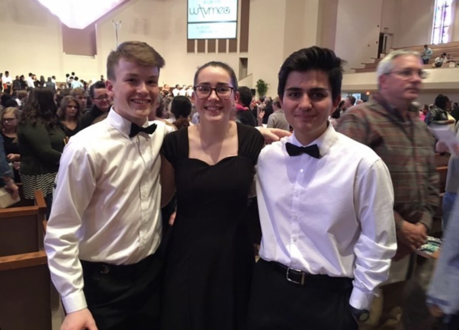 White+Station+singers+Charlie+Huebner%2811%29%2C+Maddie+Hitching%2811%29%2C+and+Gino+Giorgianni%2811%29+pose+after+performing++with+the+All-West+honor+choir.