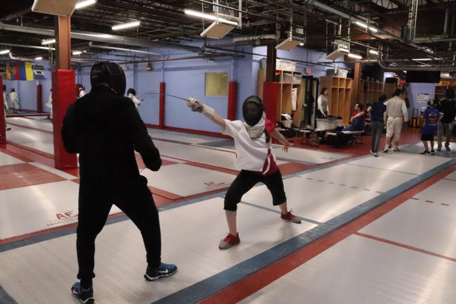 Mya Schroder (11) spars with coach Sergey Petrosyan at a Raptors practice on Thursday, Nov. 21. Schroder has attended the Raptors club at MUS since late August to improve her fencing.