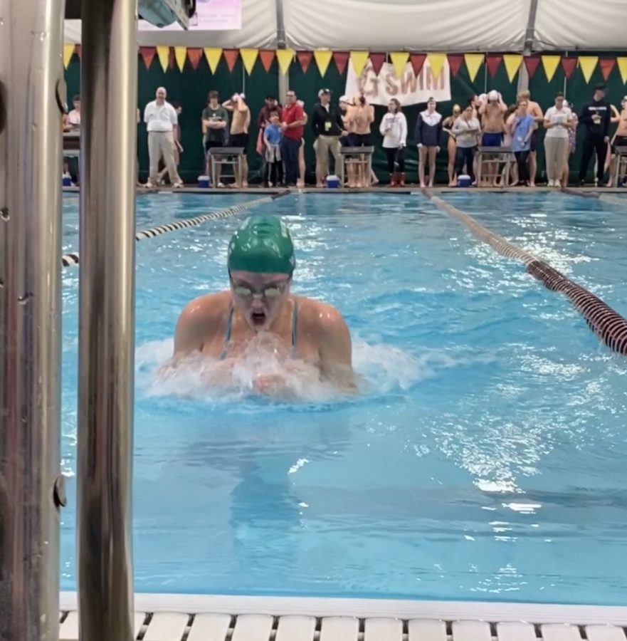 Annie Kannady (12) swims the 50 breaststroke race during the 2020 county championship meet on Saturday, Jan. 25. The meet lasted the entire day, starting with the qualifying races in the morning and ending with finals in the evening. 
