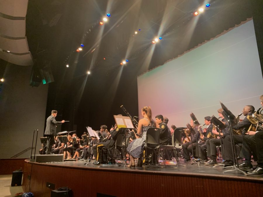 Jacob Campos, director of bands at Franklin High School, conducts the Gray Band for their final performance. Campos was one of two guest conductors who were invited to participate in the U of M Honor Band this year. 