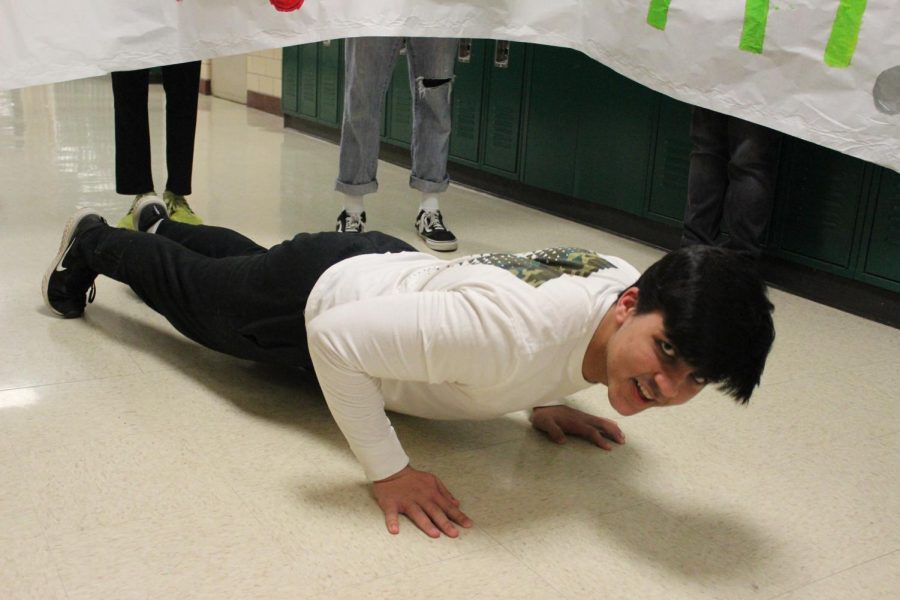 Muaz Khan (12) builds his upper body strength with push-ups. When he is not at the gym, he does pull-ups, push-ups, and ab exercises.
