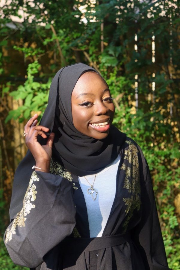   Jara Jawneh (12)  poses wearing one of Kala Boutique’s Africa kerr necklaces. Kala Boutique was founded by Jawneh and offers Africa kerr necklaces and other jewelry products for sale. 
