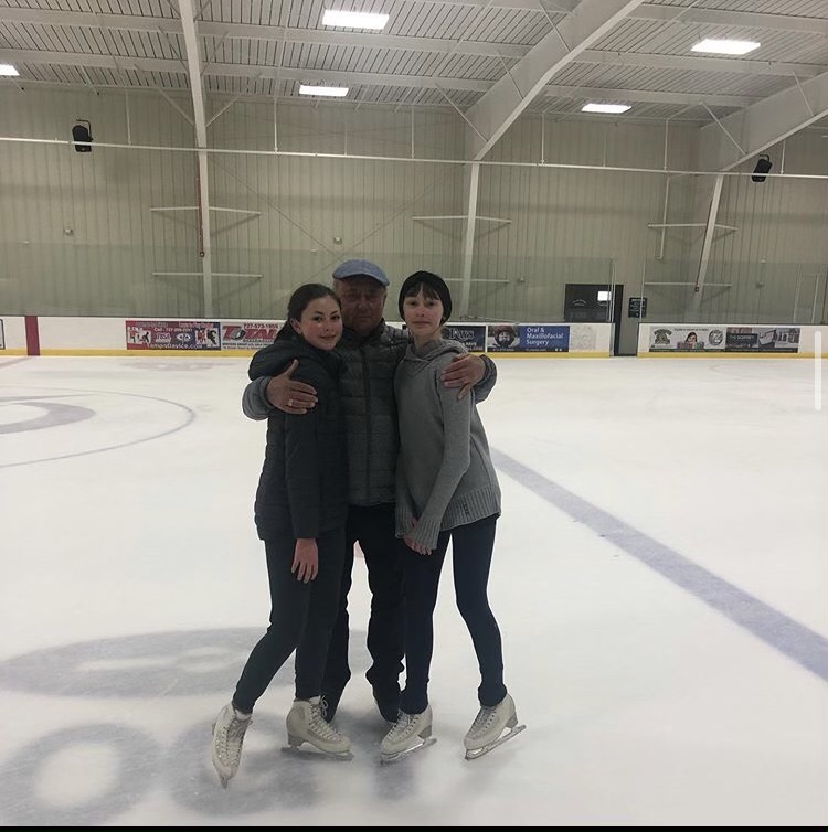 Alexandra Shirley (10) and Gabby Shirley (9) pose with the world-famous coach Alexei Mishin. During the coronavirus pandemic, most sports and group events have either been cancelled or changed drastically, and ice skating is no exception.