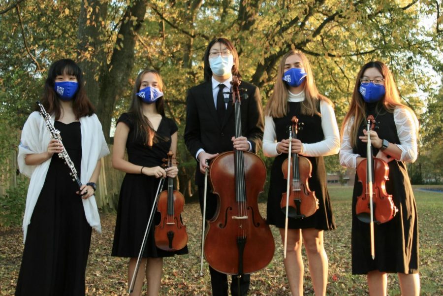 Left to right: Molly Yuan (12), Abby Cassius (11), Anyu Gu (10), Zoe Wolfe (12) and Lily Zeng (12) performed a quintet together in the Memphis Youth Symphony. Students can safely perform with others through the program. 