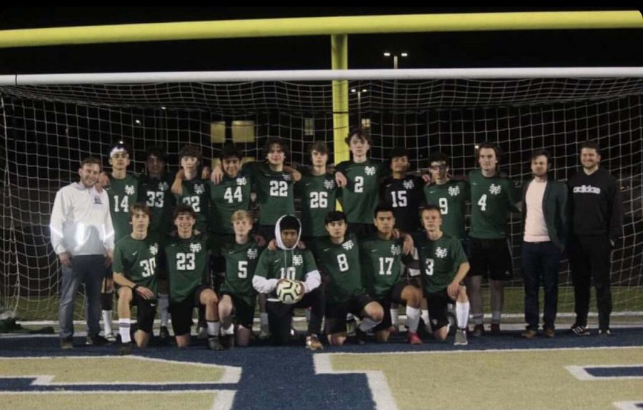 The boys soccer team poses for a team picture after their first and only game of last season. The players are excited for the chance to have a season. 