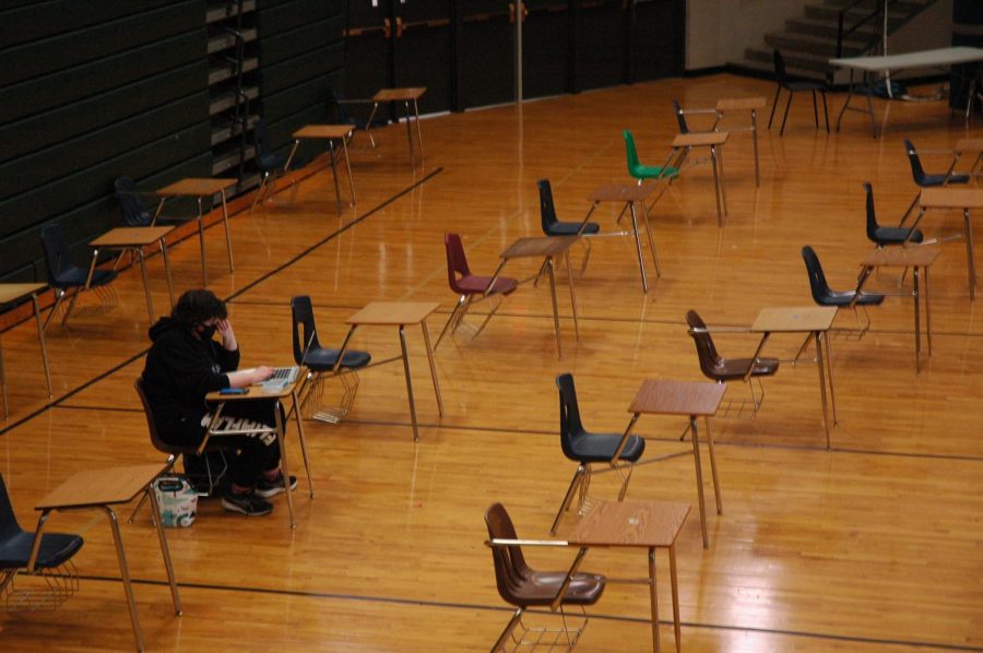 The senior gym is lined with desks for returning students, yet only three seats were taken in this study hall. Out of 2,205 enrolled students, only 180 returned for in-person learning, sparking feelings of isolation for those that came back.