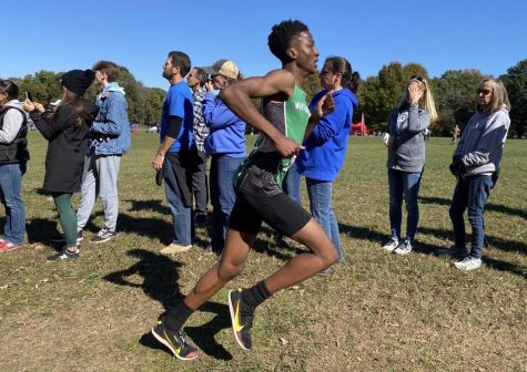 Jarryn Lowe (10) runs past spectators as he tries to make a name for himself at the state championship. With a mile left in the race, he knows it won’t be easy but he is ready to give it everything he has.