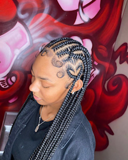 Destiny Rodriguez (12)  often designs feed-in braids for her clients. She freestyles hearts and other designs into her clients’ hair for an extra twist.