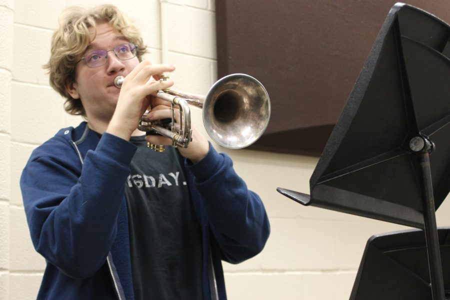 Wearing his “It’s Thursday” shirt, Forrest Dixon (11) plays after jazz band third period. He has been in the class for two years and has just attended the 2022 All West Clinic as first chair in the Blue Band for their jazz band. 