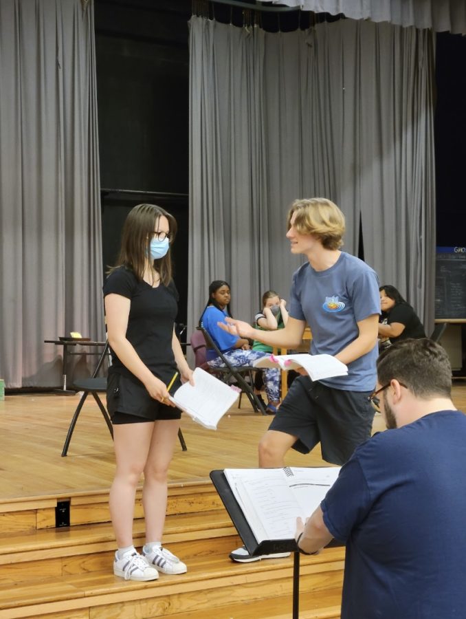 Sulan Rochelle (10) and Owen Keeton (12) rehearse a conversation in the musical. The emotion sparks out from Keeton during this interaction between such contrasting character types of Sarah Brown and Sky Masterson, respectively.
 