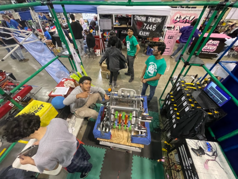 As team 5045 moves into their first competition, members prepare their bot for the fight. They come back round after round with something new to fix.
