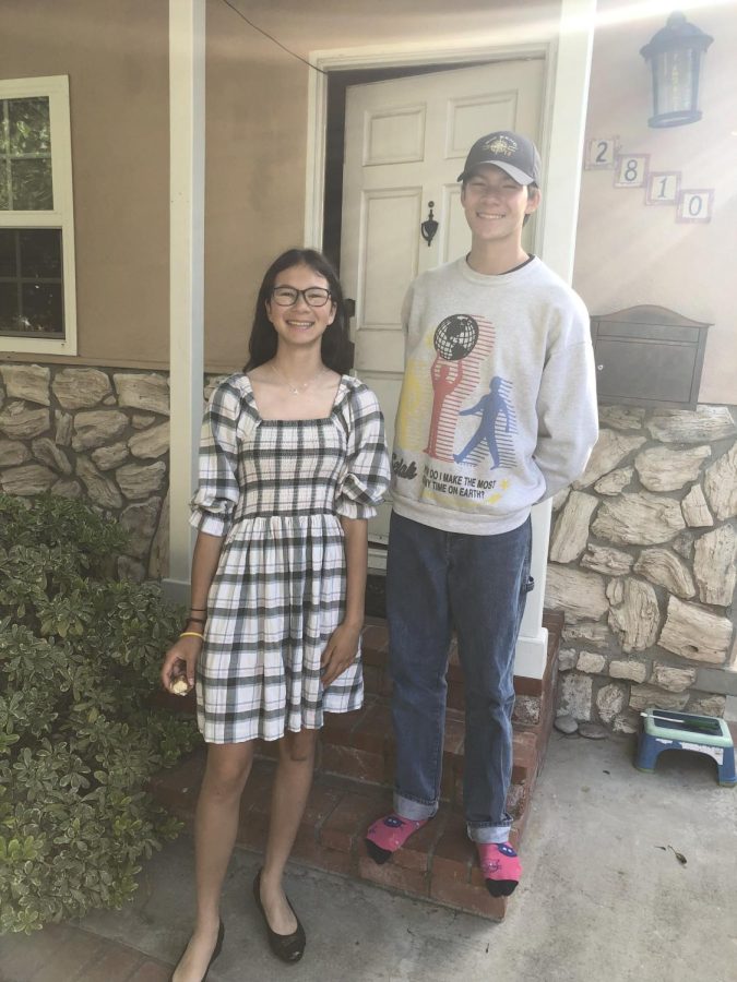 On the morning of their last day of school in Culver City, Calif., Jackson Eyre (11) and Kiran Eyre (9) pose in front of their home for their mom’s camera. The siblings first toured White Station back in December of 2021 and moved to Memphis in June of 2022.