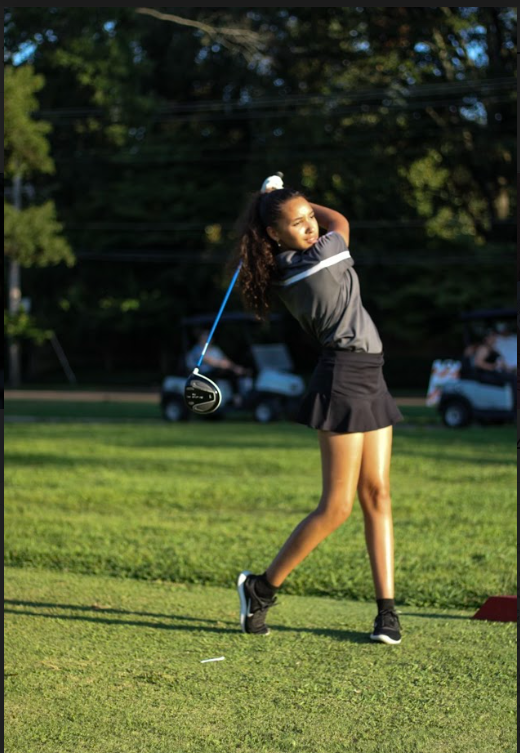 London Haines (10) swings her club at Audubon Park. Haines has only been playing golf on the school team for two years, but has quickly established herself as a key player.
