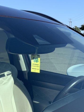  Bright yellow parking passes hang from the rearview mirrors of almost every student’s car on campus. This measure was instituted in an effort to monitor that only approved students are driving to school every day. That is, those with a valid driver’s license and proof of insurance. 