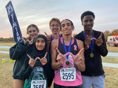 Gabrielle Shirley (11), Sukaina Alhaidari (9), Russell Wolfe (12), Justice Clarke (12) and Jarryn Lowe (11) flaunt a “W” after racing in the TSSAA Region 8 AAA competition on Oct. 27, 2022. These five Spartans qualified for the state championship.