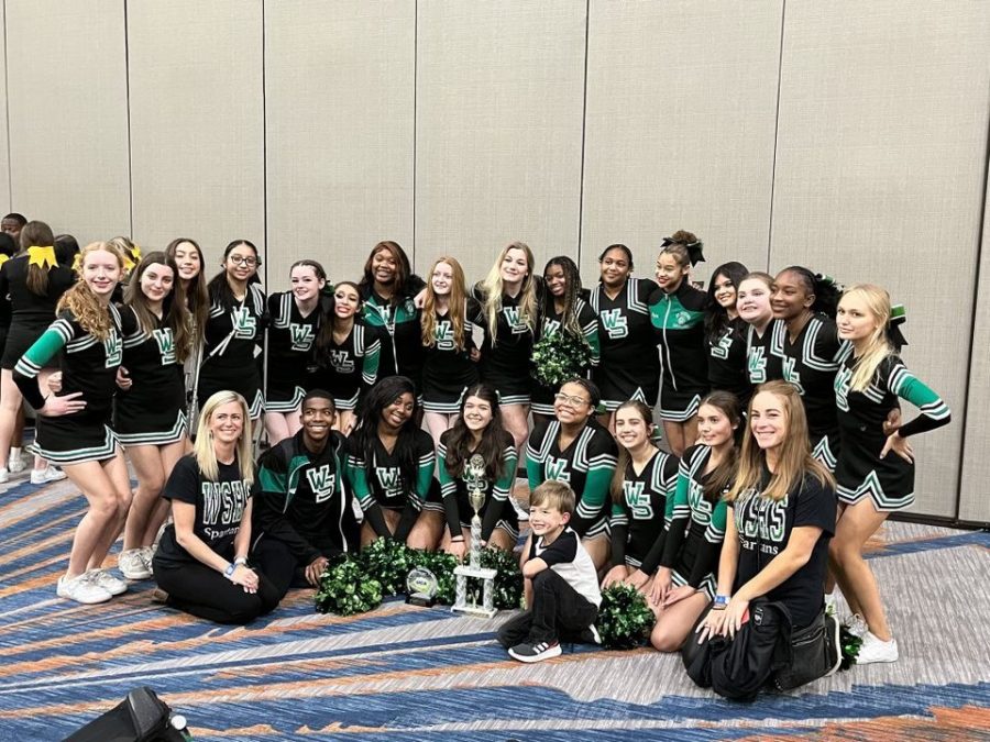 The+Spartan+varsity+cheer+team+celebrates+a+first+place+win+on+Oct.+29+in+the+Mid-South+Regional+Cheer+competition.+The+team+will+travel+to+Disney+World+in+February+of+2023.+%0A