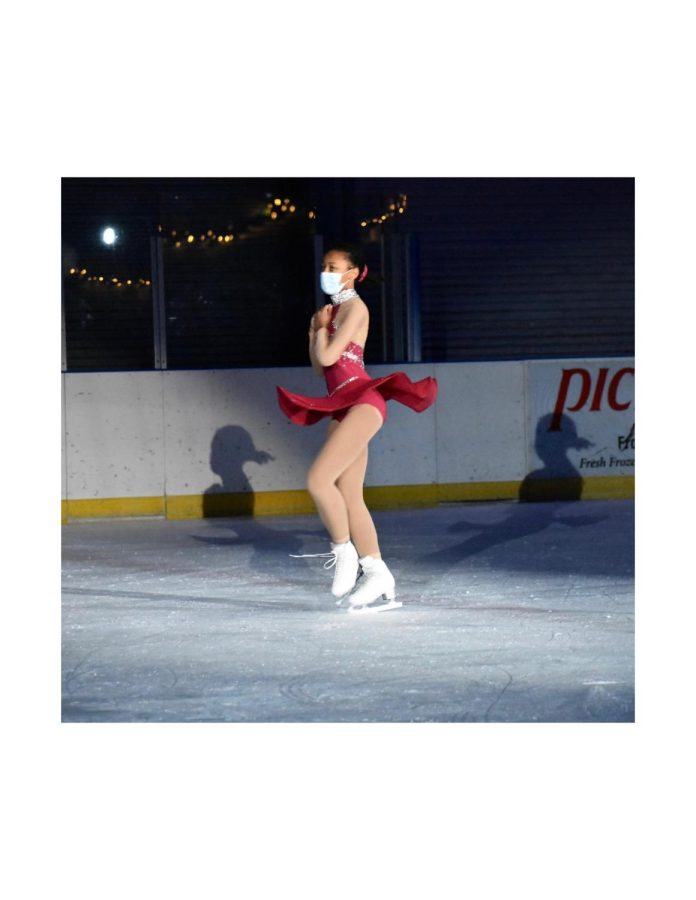 Rebekah Butler (12) performs at the 2020 Winter Showcase for Theatre on Ice. Butler skated alongside a team of girls in winter-themed performances such as The Polar Express.