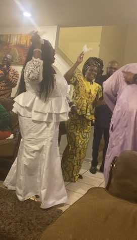  Friends and family of French and English teacher N’Koumitcha Tassa dance on Jan. 1 to ring in the New Year. The group danced a traditional dance of Togo.