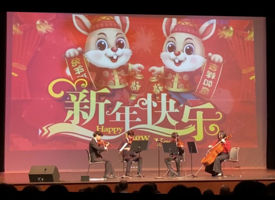 Andrew Zhou (9) (third from the left) plays his viola in a string quartet along with other White Station students. They played traditional Chinese music.