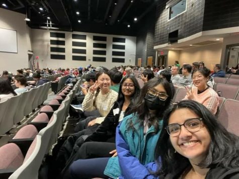 From top left to bottom right, Amy Zhang (10), Shaniya Thomas (12), Spoorthi Marada (12), Chitkala Alli (11), and Lena Zeng (11) take a picture in the auditorium of John Hopkins High School. This snapshot was taken during the award ceremony.
