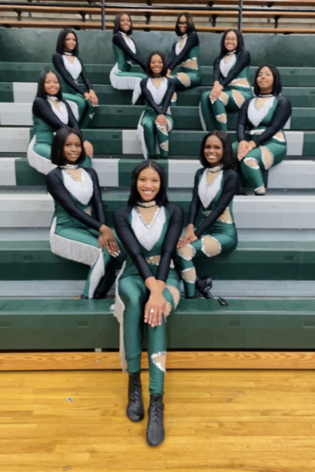 Kariana Crutchfield (12), Ti’Nia Hayes (9), Kennedi Turner (10), Kennede Taylor (9), Lauren Hunter (11), JaMyla Marner (9), Imani Hayes (9), Kayla Burton (9), Joselyn Carter (9) and Ashlyn Holmes (9) pose for a picture before their first performance on Dec. 8 at a basketball game against Ridgeway High School.
