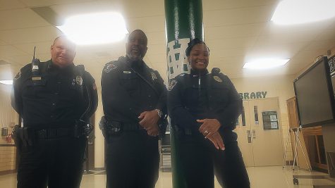 Officers Robert Stewart, Franklin Wade and Ebony Hendricks stand guard in the lobby of the Main Building. The officers split up to monitor different parts of the school throughout the day. 