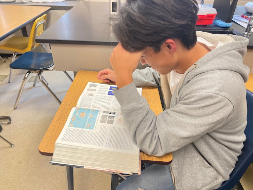Fourth in the class of 2024 Jason Fang, studies for one of his AP classes. As class rank is determined by GPA, high-ranking students take many AP classes for the GPA boost.