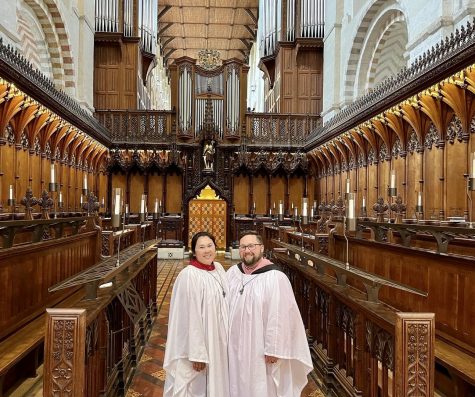 Joseph Powell stands with his wife in Saint Albans Cathedral in St. Albans England. Choir allowed Powell to travel the world as a musician in residency with his church, Calvary Episcopal.
