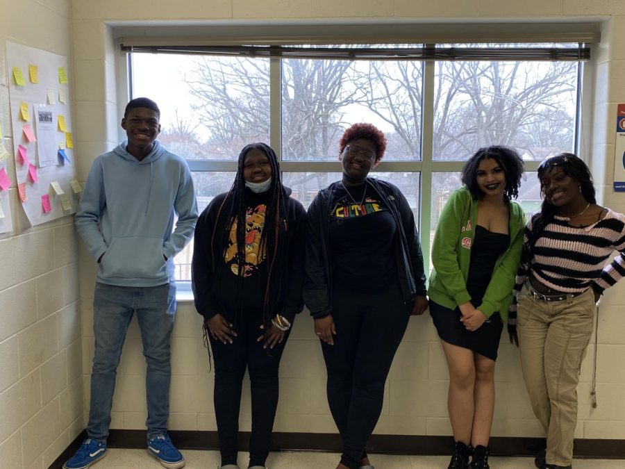 Club members Joseph Stewart (12), Angel Ishmeal (9), A’Ziya Wills (12), Jamison Joyner (12) and Kierston Connor (12) (from left to right) line up after their biweekly Pan African Club meeting. The club of diverse students meets to discuss art, culture, and recent news in a safe and welcoming space provided by Ms. Davis, the AP African American History teacher. 