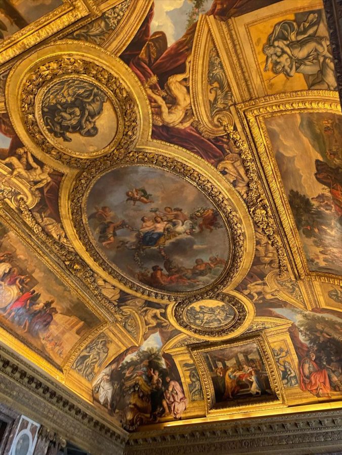 The ceiling of the Palace of Versailles, the former royal residency, is known for its abundance of medieval art. French students spent 10 days in France.
